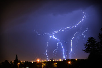 Blue and white Lightning bolt strike over Kempton Park in South Africa showing absolute energy that is in nature that is so unpredictable and beautiful