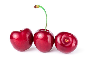 Three sweet cherries, isolated on white background
