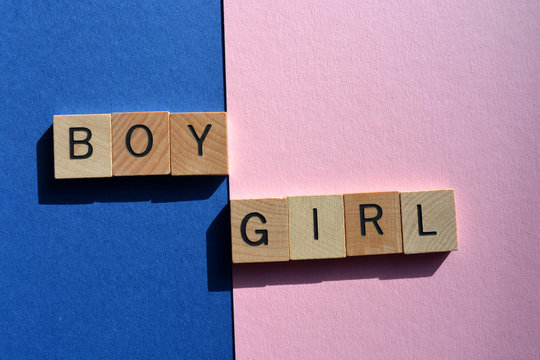 Boy, Girl, Words on blue and pink, creative concept of gender stereotypes