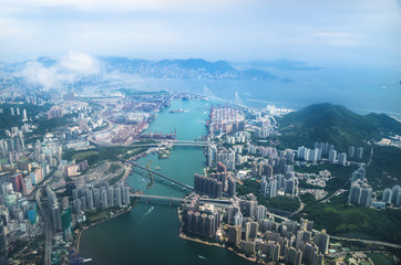 Aerial view of Hong Kong islands with skyscrpers and industry from a flying airplane