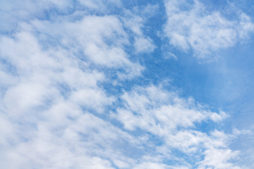 Naklejka na ściany i meble .White cumulus clouds against the background against blue on a blue background.