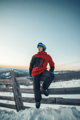 Fototapeta na wymiar Snowboarder on background sunset and beautiful landscape of the Sheregesh, Russia.