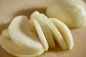 A peeled and sliced yellow onion