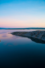 Sea and sky with clouds at sunset.