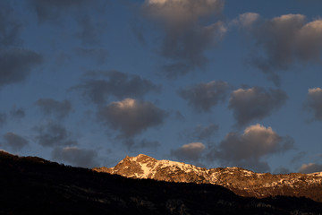 Fototapeta premium sunset in mountains,landscape,panorama,clouds,nature,peak,rock,blue,sky,