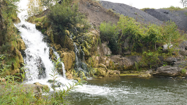 Belovsky waterfall in the Iskitim district of the Novosibirsk region. Summer trip to Russia