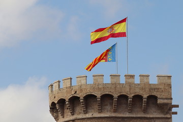 Flags on Torres de Quart in Valencia, Spain