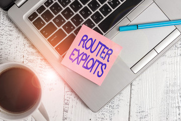 Writing note showing Router Exploits. Business concept for takes advantage of a security flaw in an...