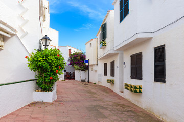 Typical Spanish architecture with white houses in Binibeca Nou village. Menorca. Spain