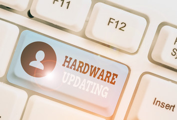 Writing note showing Hardware Updating. Business concept for process of replacing a product with a...