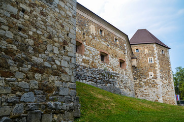 Fototapeta na wymiar Detail of Ljubljana castle. The historic medieval building with park around. Old Slovenia fortress in the center of Slovenia capital city.