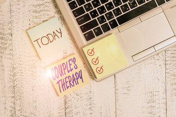 Conceptual hand writing showing Couple S Therapy. Concept meaning treat relationship distress for individuals and couples Metallic laptop three sticky note pads lying vintage table