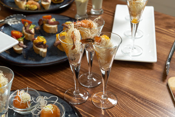 Shrimps wrapped in wheat thread and baked. Catering, beautiful table.
