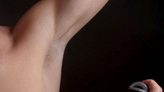 Male Spraying Fragrant Deodorant in Armpit, Using Good Hygiene, Closeup