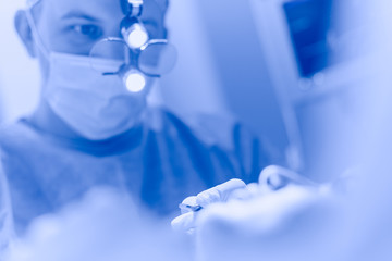 Man surgeon at work in operating room
