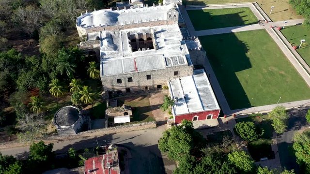Aerial turn to the right with camera down on the Convent de San Bernardino in Valladolid, Yucatan, Mexico in early morning.