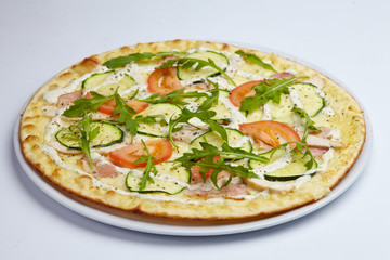 tasty pizza with tomatoes and zucchini