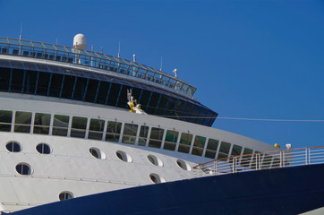 Detail view or close up of navigational bridge and superstructure of modern white and blue cruise...