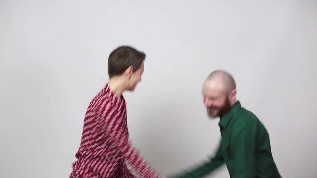 Swing dancers on white background. Man and woman are dancing lindy hop or boogie woogie dance. Happy couple dancing.