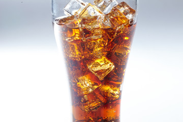 cola with ice cubes isolated