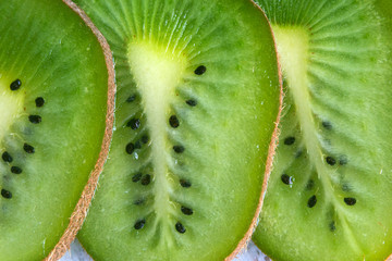 Green sweet tropical kiwi. Slices of juicy kiwi. Close-up.