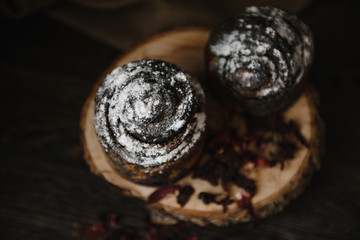 Fototapeta na wymiar homemade cupcake in powdered sugar