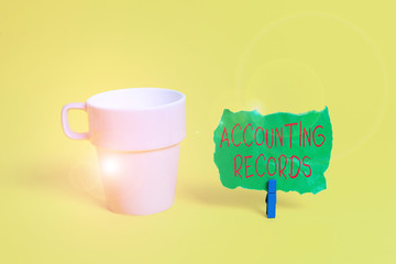 Conceptual hand writing showing Accounting Records. Concept meaning Manual or computerized records of assets and liabilities Paper blue clothespin rectangle shape reminder yellow office