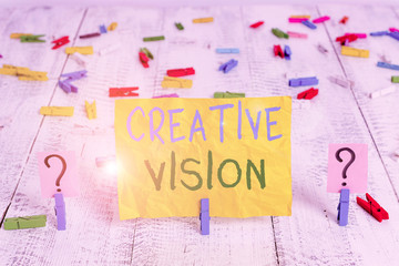 Conceptual hand writing showing Creative Vision. Concept meaning process of purposefully generating visual mental imagery Crumbling sheet with paper clips placed on the wooden table
