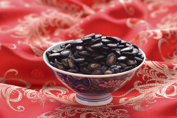 Black seed on the red table cover China