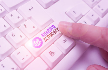 Conceptual hand writing showing Sharing Economy. Concept meaning collaborative consumption or peer...