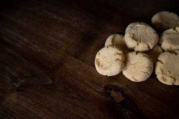 small homemade cookies on dark wood with copy space