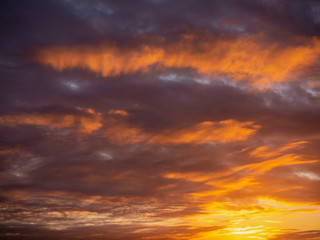 Rich colorful sunset sky. Orange and purple color. Nature background.