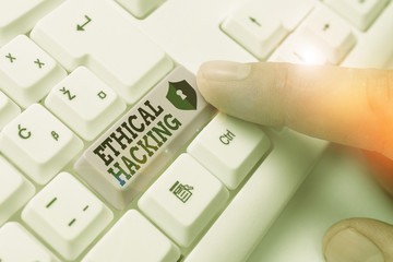 Writing note showing Ethical Hacking. Business concept for act of locating weaknesses and...