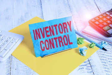 Text sign showing Inventory Control. Business photo text regulating and maximising your company inventory Notepaper stand on buffer wire in between computer keyboard and math sheets