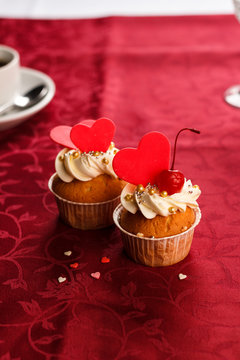 Redvelvet Cupcakes With Cream Cheese Frosting And A Red Heart On A Red Background