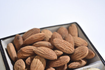 the portrait of almond on the white plate
