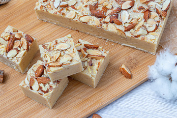 Fudge on a light table with nuts