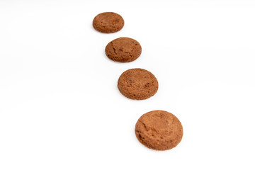 Brown chocolate chip cookies with soft tasty filling inside on a white background