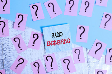 Writing note showing Radio Engineering. Business concept for Concerned with the operation and repair of radio equipment Scribbled and crumbling papers with thick cardboard above wooden table
