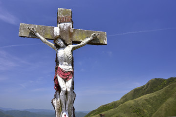 Low angle shot of the Jesus and the cross against the sky