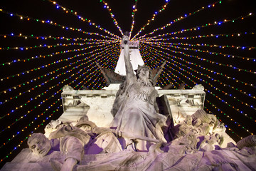 Colorful lights on a statue