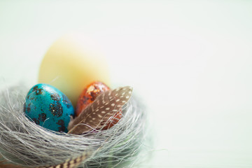 Colorful bright Easter eggs on a light background. Festive spring card