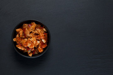 Delicious hot Asian food on a dark background.