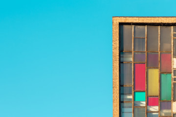 Old industrial building, large dirty windows, brick wall