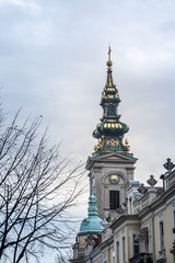 Fototapeta premium Saint Michael Cathedral, also known as Saborna Crkva, with its iconic clocktower seen from a street of Stari Grad district. It is one of the main landmarks of Belgrade, Serbia