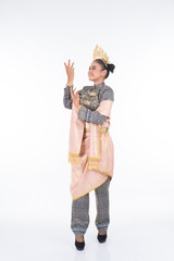 A beautiful Malaysian traditional female dancer performing the dance steps of a cultural dance routine called Tarian Inang in a traditional dance outfit. Full length isolated in white.