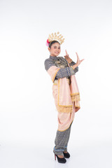 A beautiful Malaysian traditional female dancer performing the dance steps of a cultural dance routine called Tarian Inang in a traditional dance outfit. Full length isolated in white.