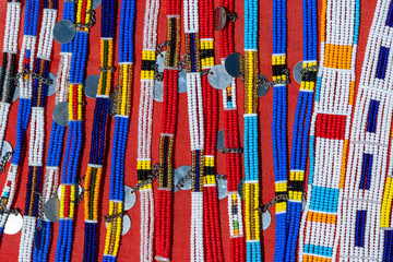 Tribal masai colorful bracelets for sale for tourists at the beach market, close up. Island of Zanzibar, Tanzania, Africa