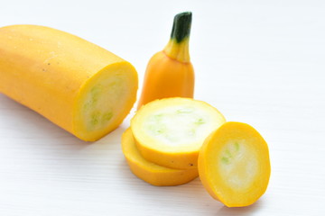 Natural, whole and chopped yellow zucchini