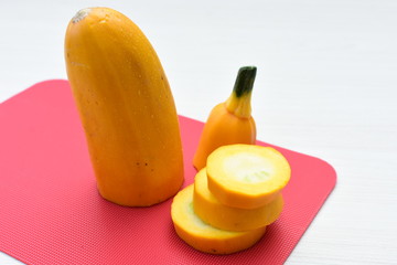 Natural, whole and chopped yellow zucchini